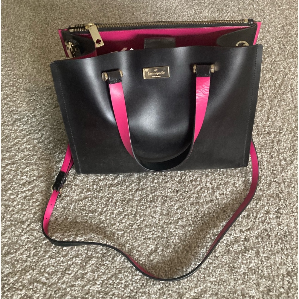 Kate Spade black leather purse with pink inside accent.